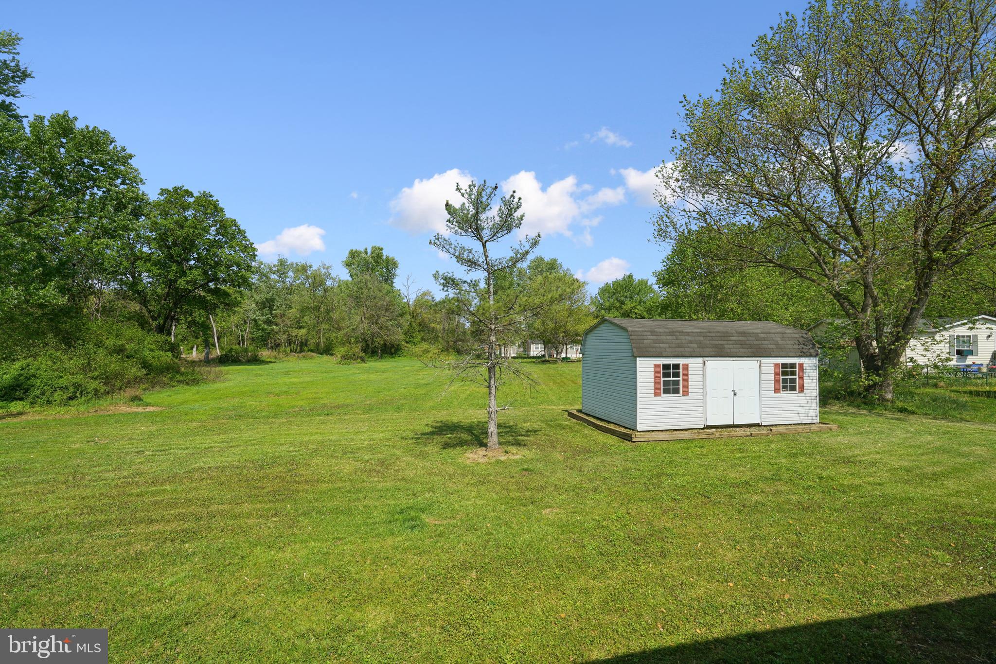 41 North Dragon Drive Bear, DE 19701 - Photo 27 of 30 a sign that is sitting in the grass with of trees