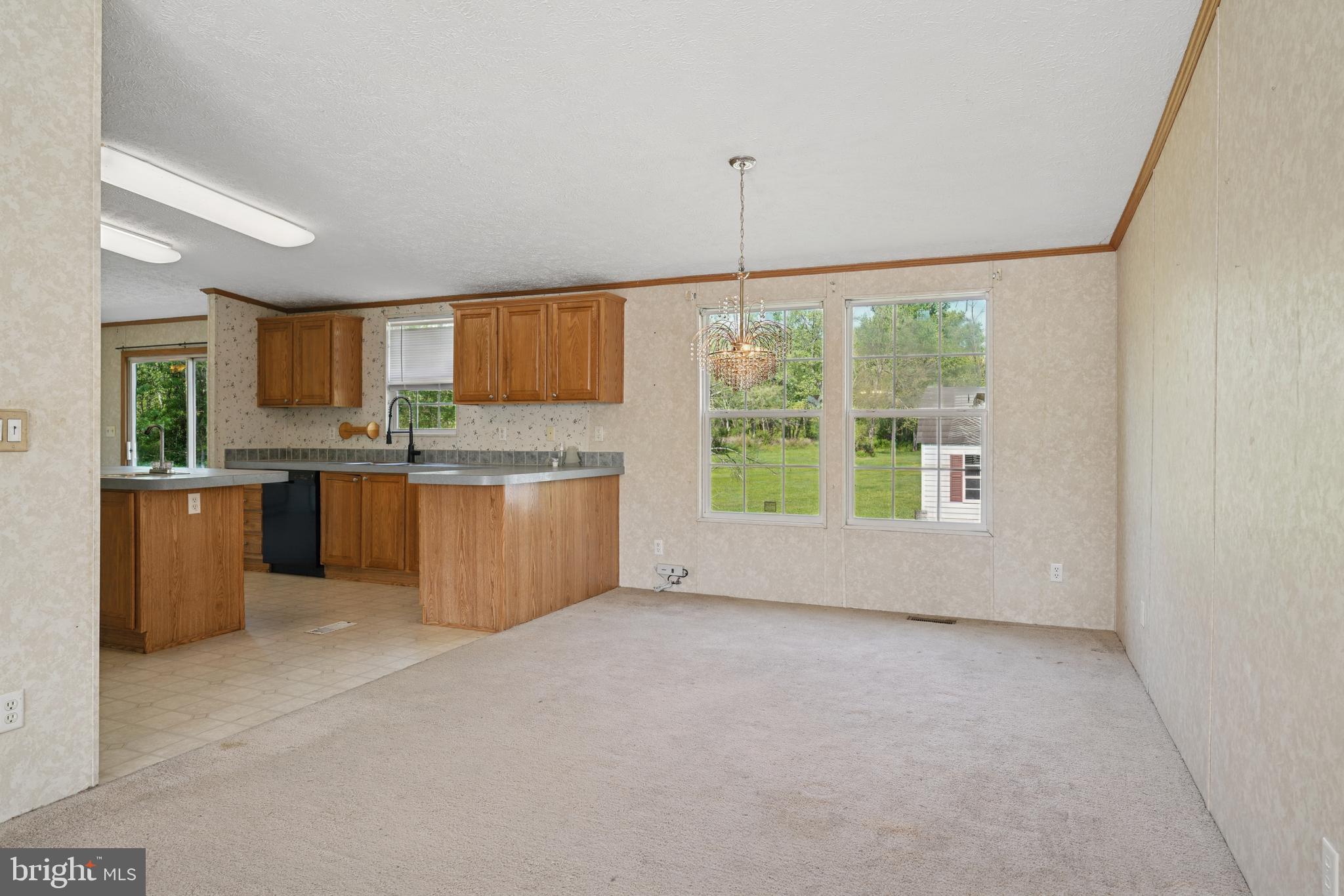41 North Dragon Drive Bear, DE 19701 - Photo 7 of 30 a kitchen with stainless steel appliances granite countertop a stove and a sink