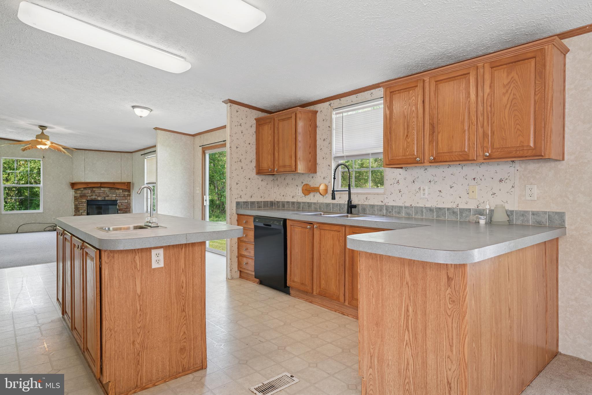 41 North Dragon Drive Bear, DE 19701 - Photo 8 of 30 a kitchen with a sink stove top oven and cabinets