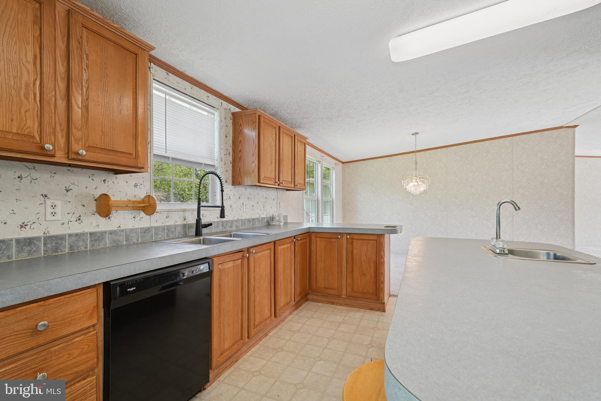41 North Dragon Drive Bear, DE 19701 - Photo 10 of 30 a kitchen with stainless steel appliances granite countertop a sink stove and cabinets