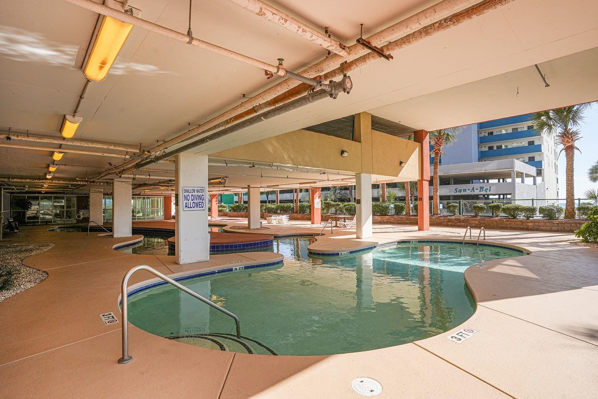 1707 Perrin Drive, Unit 606 North Myrtle Beach, SC 29582 - Photo 36 of 40 Indoor community pool with a patio and a hot tub