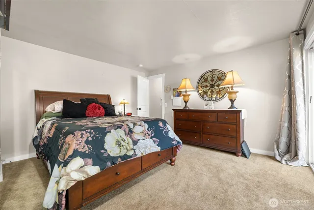 a bedroom with a bed and a table