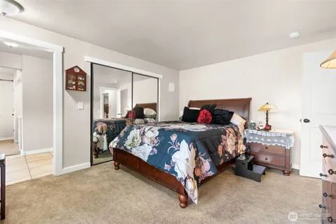 a bedroom with a bed and a cabinets