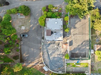 an aerial view of a house with a swimming pool