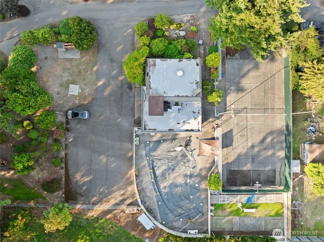 an aerial view of a house with a swimming pool