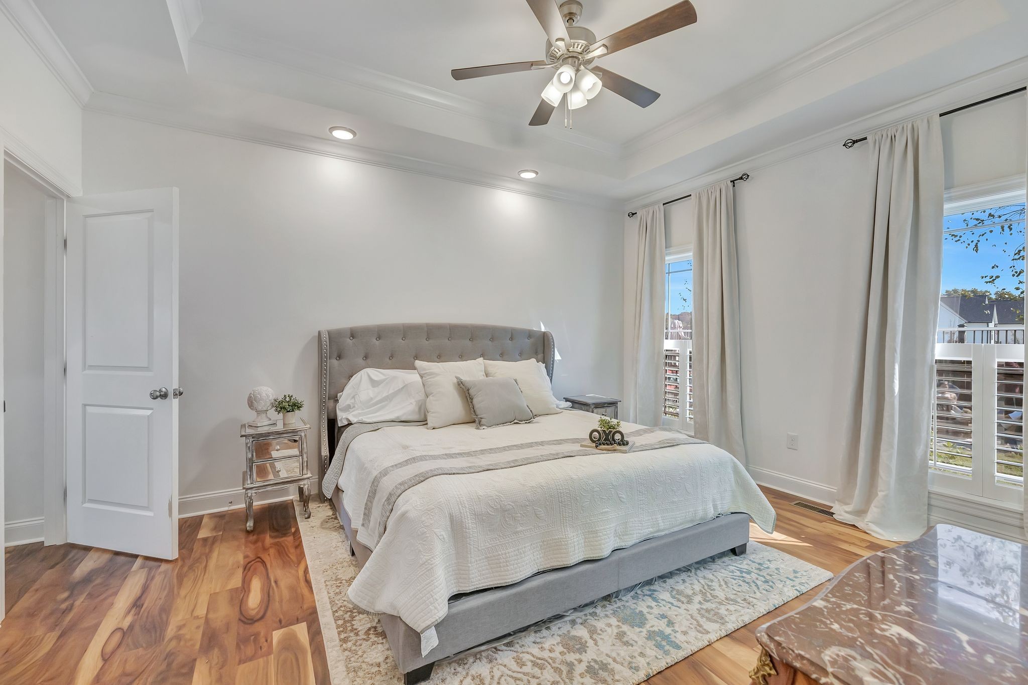 4711 Lunns Store Road Chapel Hill, TN 37034 - Photo 14 of 34 a bedroom with a large bed and a chandelier