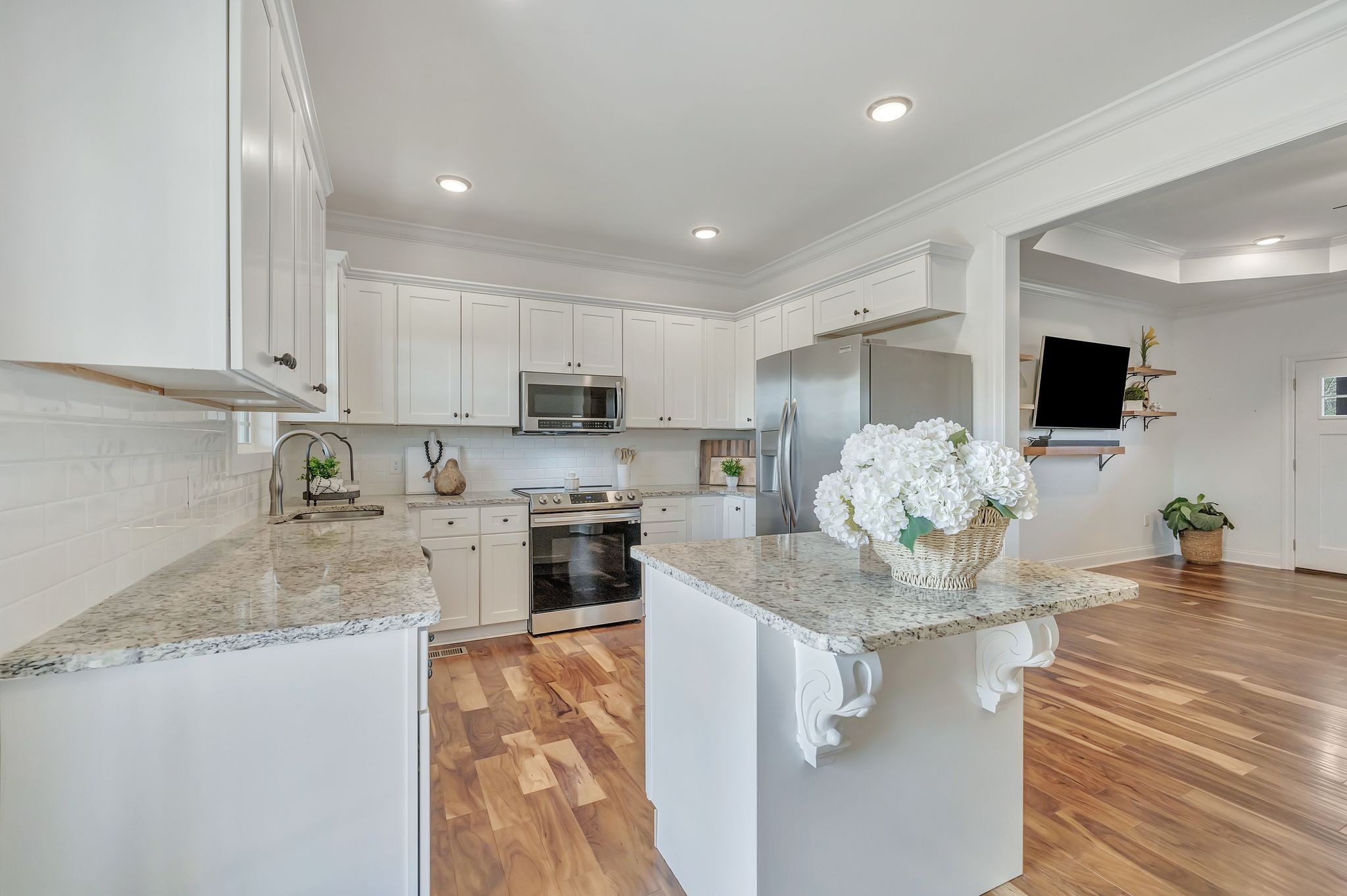 4711 Lunns Store Road Chapel Hill, TN 37034 - Photo 9 of 34 a kitchen with kitchen island granite countertop stainless steel appliances and white cabinets