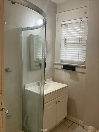 a kitchen with a stove and a window