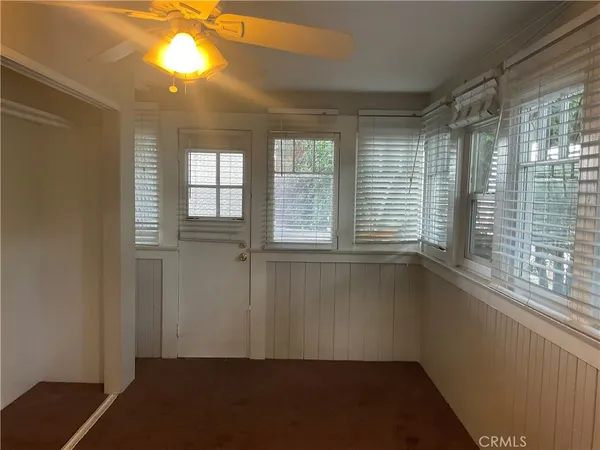 a view of an empty room with a window