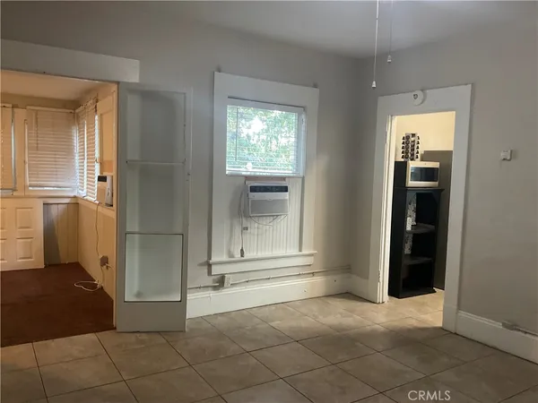 an empty room that has a window in it