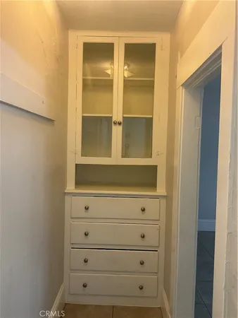 a bathroom with a toilet a sink and a window