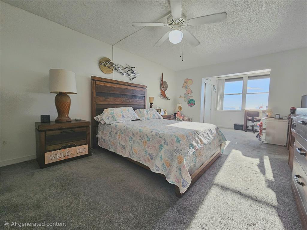 4525 Cove Circle, Unit 1002 St. Petersburg, FL 33708 - Photo 17 of 42 a bedroom with bed and window