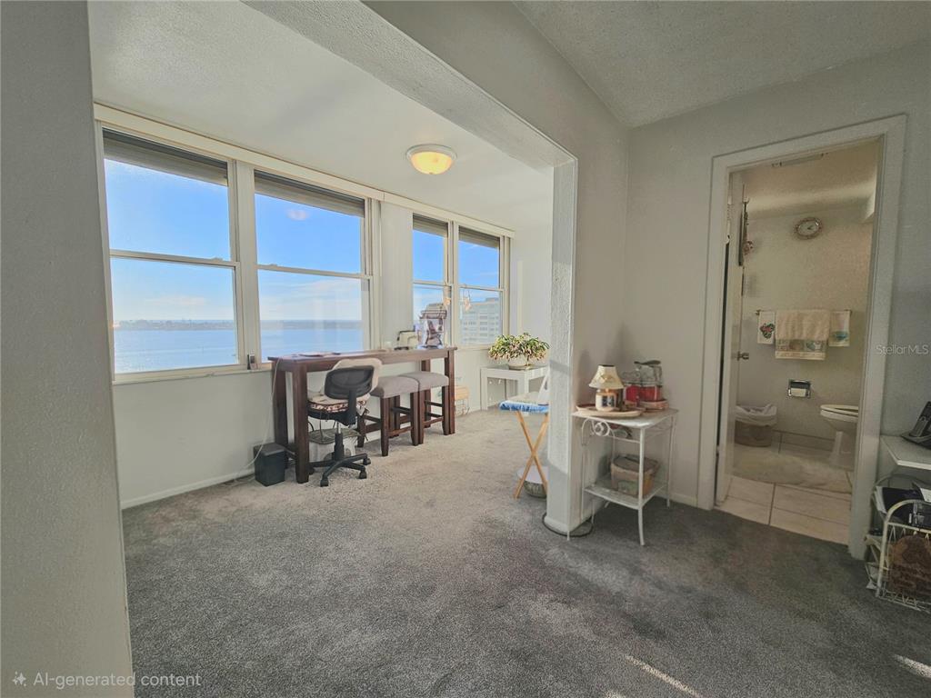 4525 Cove Circle, Unit 1002 St. Petersburg, FL 33708 - Photo 22 of 42 a view of a workspace with furniture and a window