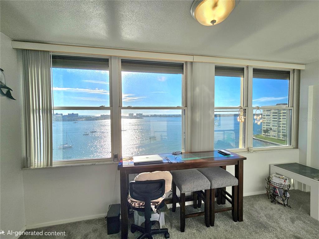 4525 Cove Circle, Unit 1002 St. Petersburg, FL 33708 - Photo 23 of 42 a view of a dining room with furniture and window