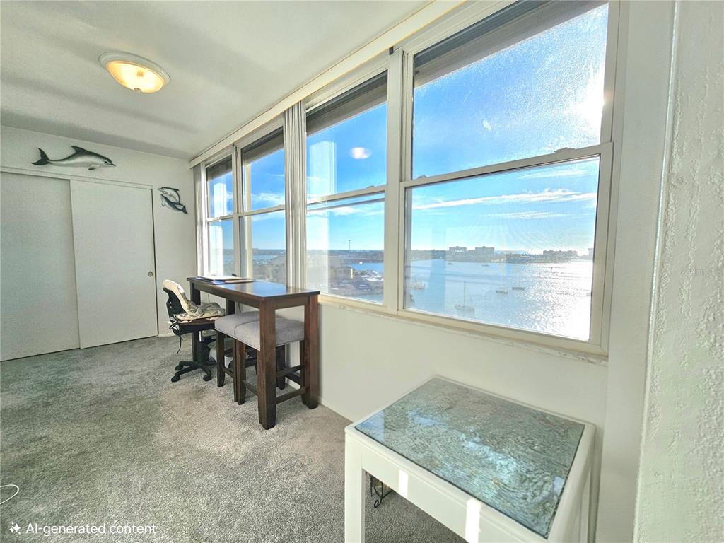 4525 Cove Circle, Unit 1002 St. Petersburg, FL 33708 - Photo 24 of 42 a view of a workspace with furniture and a window