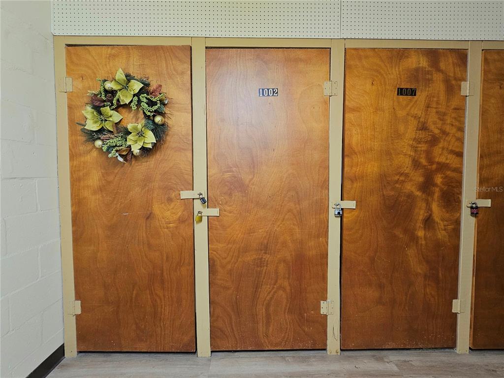 4525 Cove Circle, Unit 1002 St. Petersburg, FL 33708 - Photo 31 of 42 a view of a bathroom with a glass door