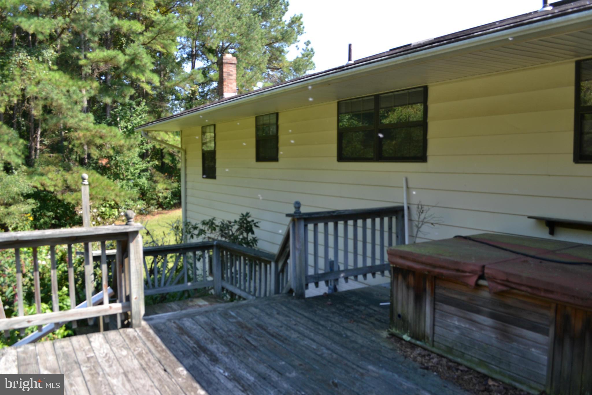 5851 Cari Road Huntingtown, MD 20639 - Photo 18 of 24 DECK OVERLOOKING HUGE YARD/ PRIVATE