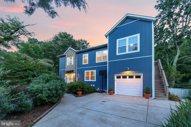 a front view of a house with trees