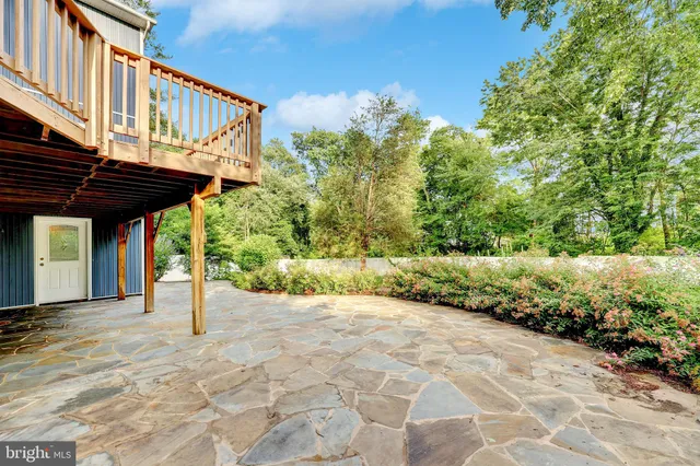 a view of a chair and table in the patio