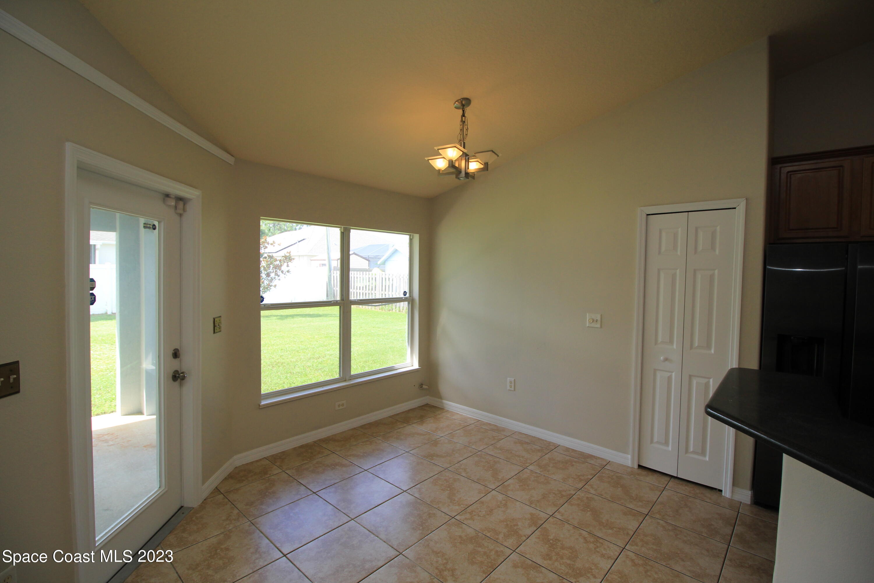 492 Eldron Boulevard Southeast Palm Bay, FL 32907 - Photo 12 of 28 a view of an empty room with a window