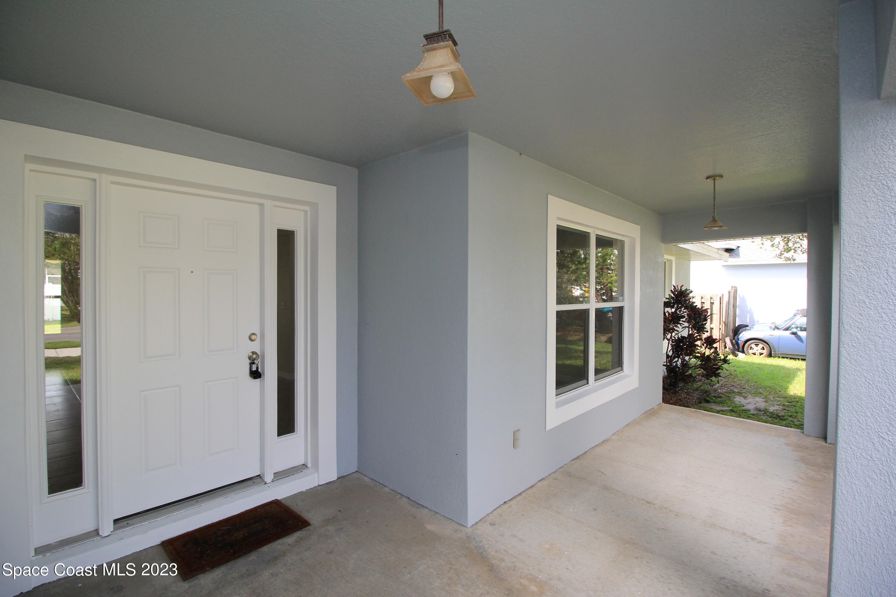492 Eldron Boulevard Southeast Palm Bay, FL 32907 - Photo 4 of 28 a view of a room with window and hardwood floor