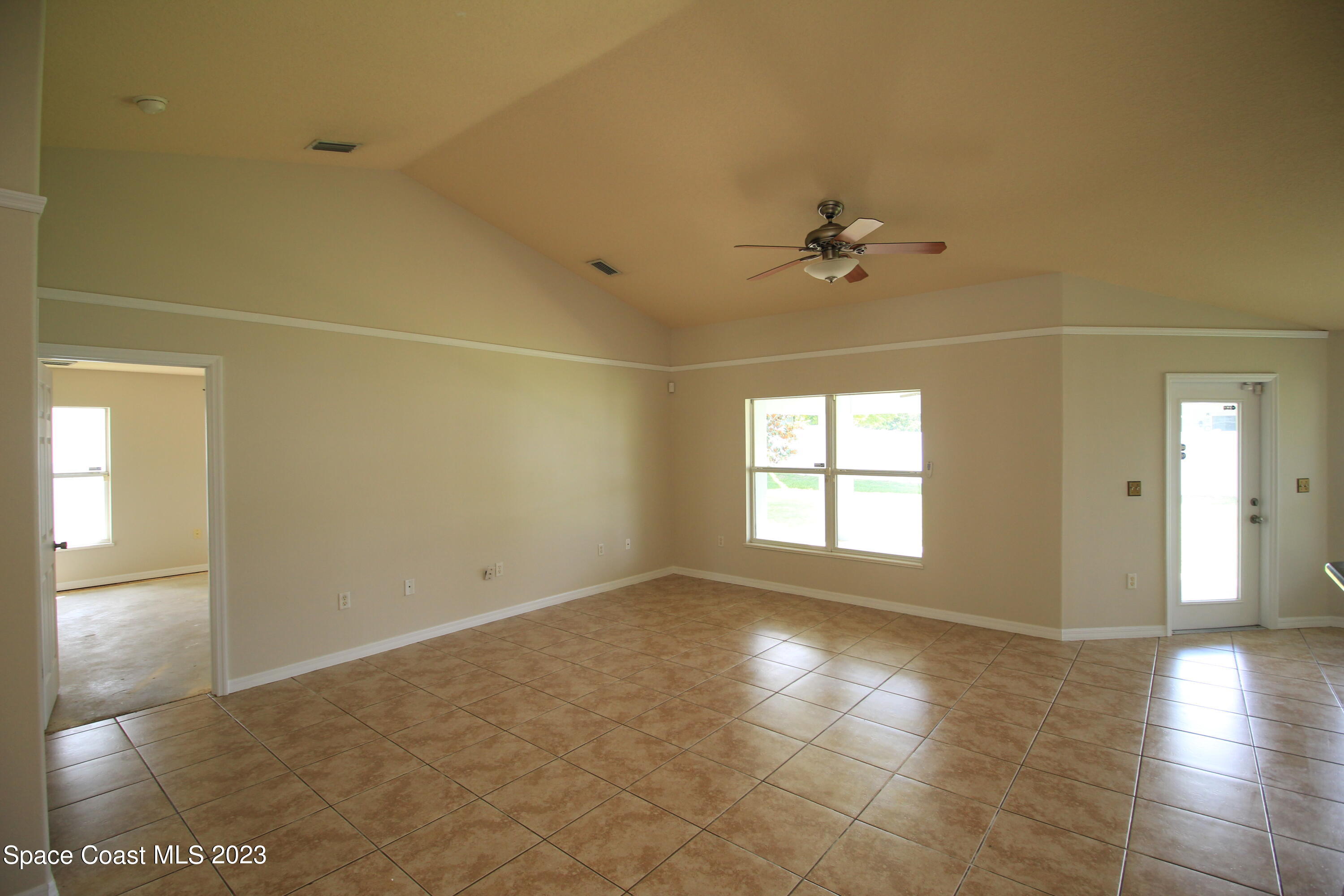 492 Eldron Boulevard Southeast Palm Bay, FL 32907 - Photo 10 of 28 a view of empty room with a window