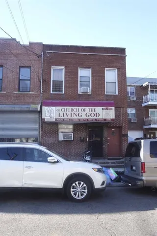 a front view of a building with parking space