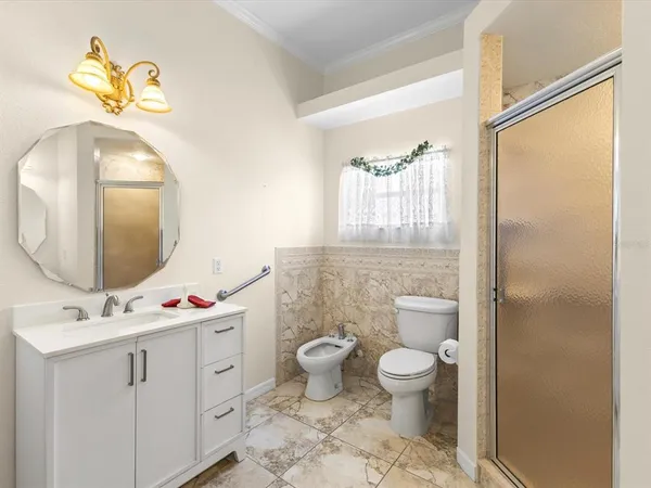 a view of a porch with wooden floor and front door