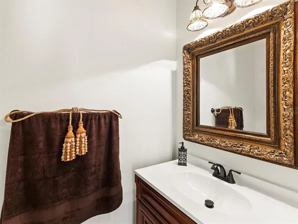 a view of a room with wooden floor chandelier and window