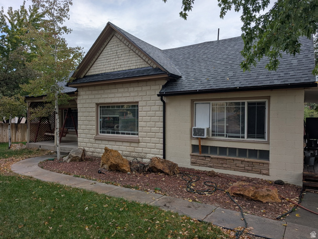 1341 East Crk Road Sandy, UT 84093 - Photo 9 of 24 View of side of property featuring roof with shingles