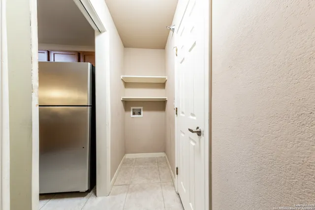 a bathroom with a shower and a door