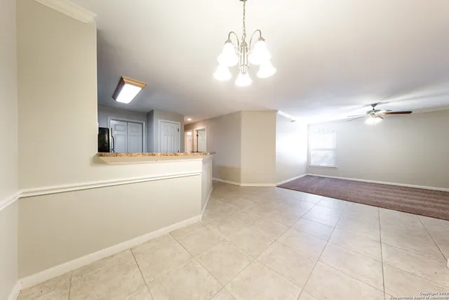 a view of a kitchen with a sink and cabinet area