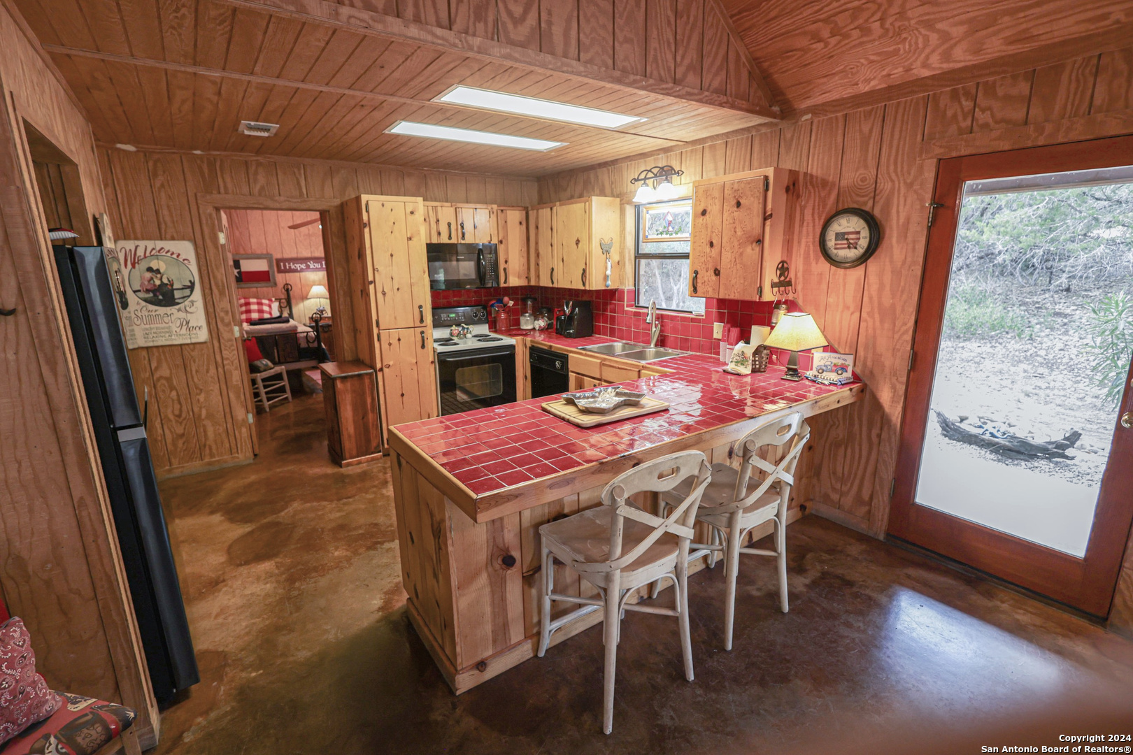 1177 River Road Concan, TX 78838 - Photo 11 of 34 a dining room with furniture and window