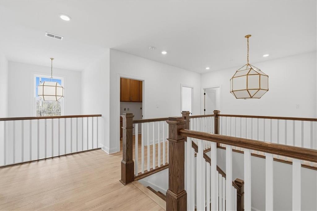 291 McMurray Road Pittsburgh, PA 15241 - Photo 23 of 31 a view of staircase with railing and a chandelier
