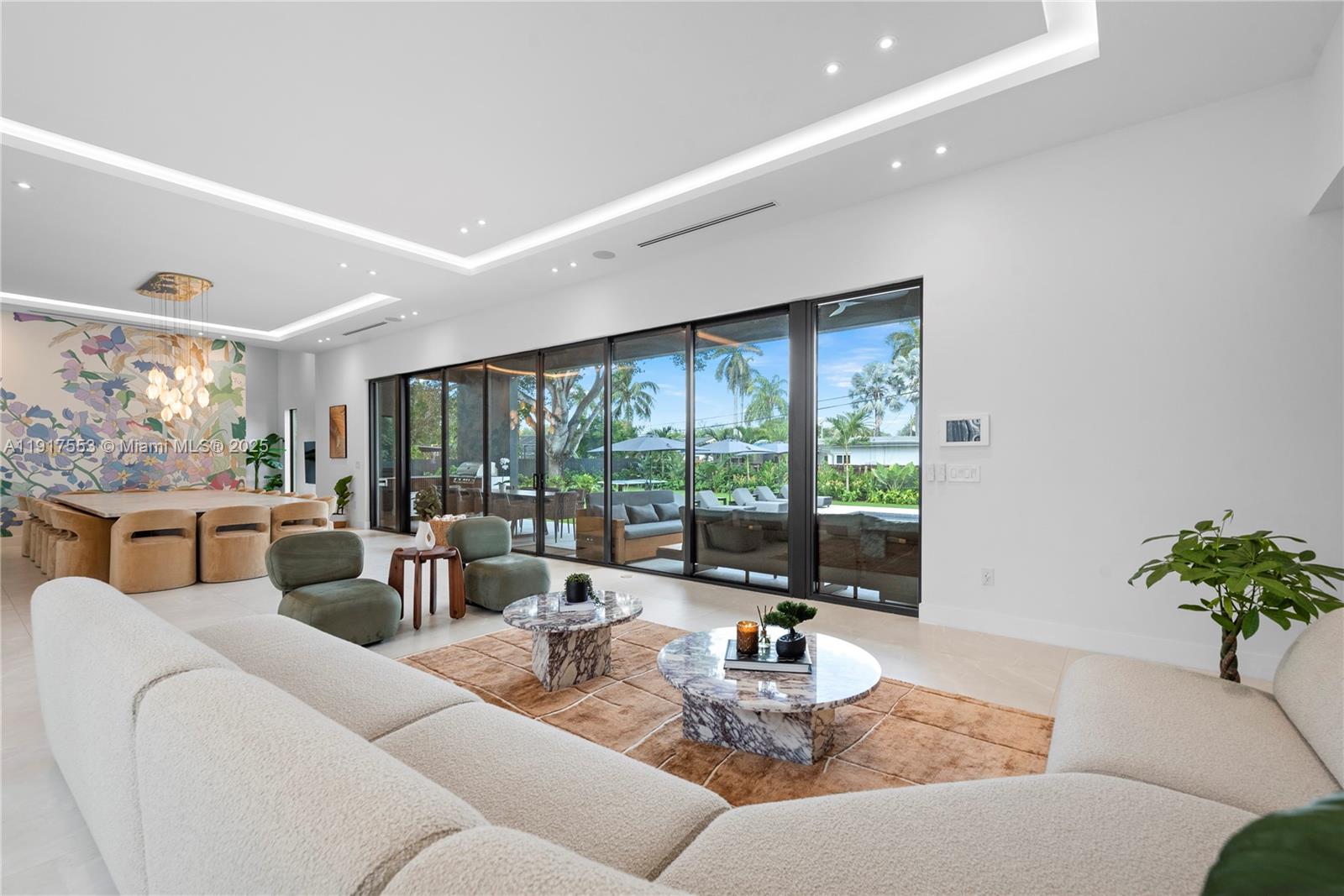 1881 Northeast 196th Terrace Miami, FL 33179 - Photo 13 of 98 a living room with furniture and a large window