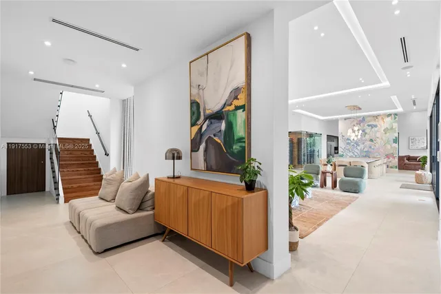a view of a house with swimming pool and sitting area