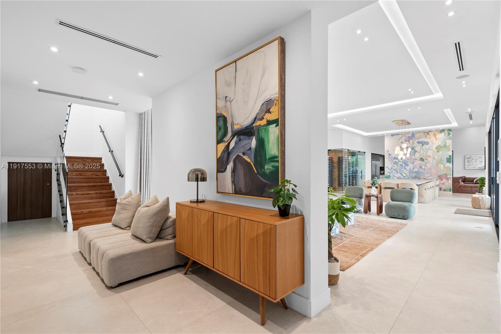 1881 Northeast 196th Terrace Miami, FL 33179 - Photo 19 of 98 a living room with furniture and wooden floor
