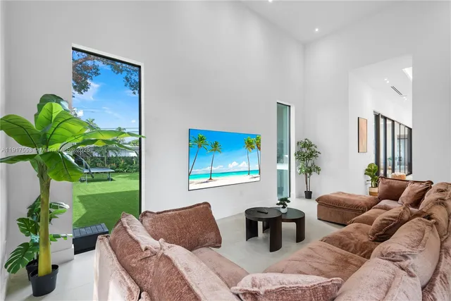 a view of a house with backyard and a sitting area