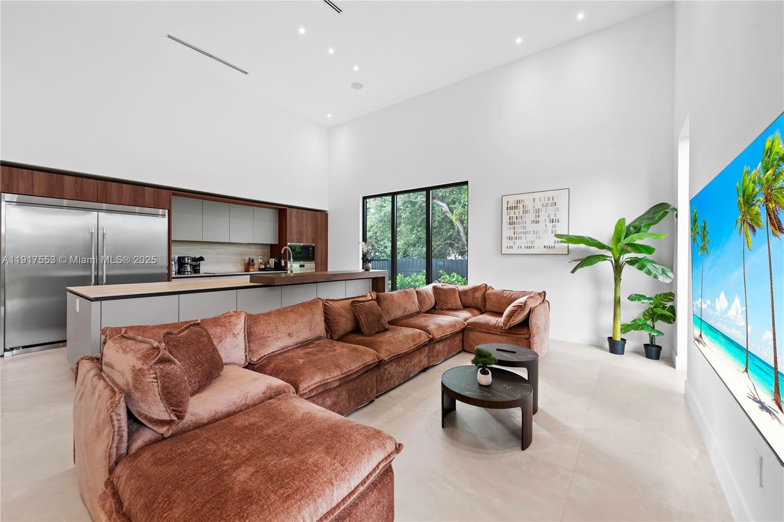 1881 Northeast 196th Terrace Miami, FL 33179 - Photo 22 of 98 a living room with furniture garden view and a potted plant