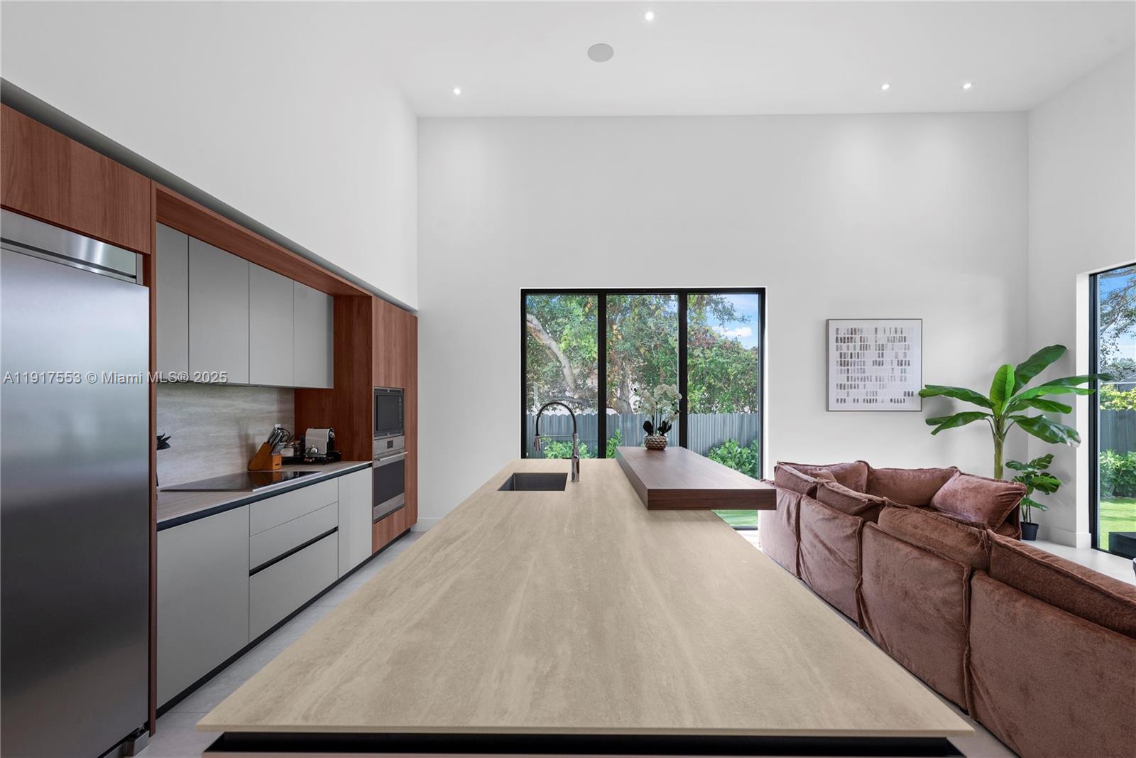 1881 Northeast 196th Terrace Miami, FL 33179 - Photo 25 of 98 a living room with furniture and a large window