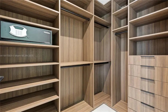 a bathroom with a shower and a sink