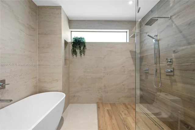 a large white bed in a white room