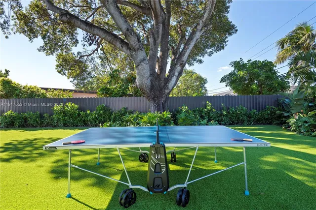a bed room with two bed and a window