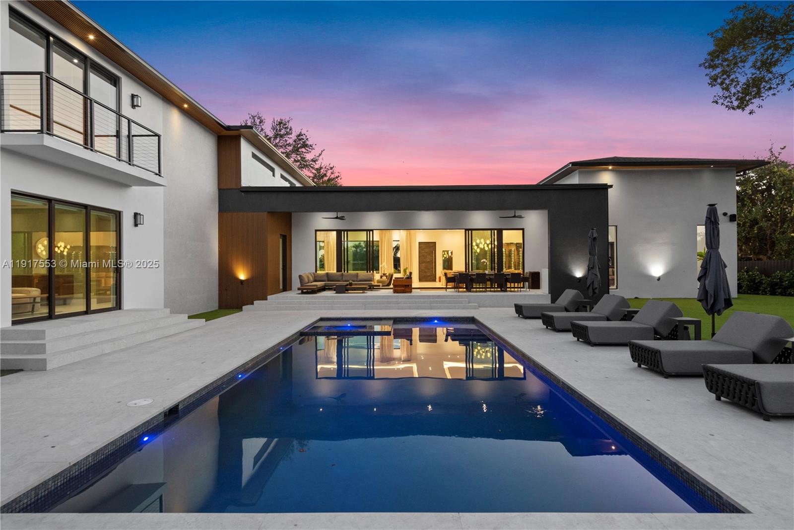 1881 Northeast 196th Terrace Miami, FL 33179 - Photo 43 of 98 a view of a house with swimming pool and sitting area