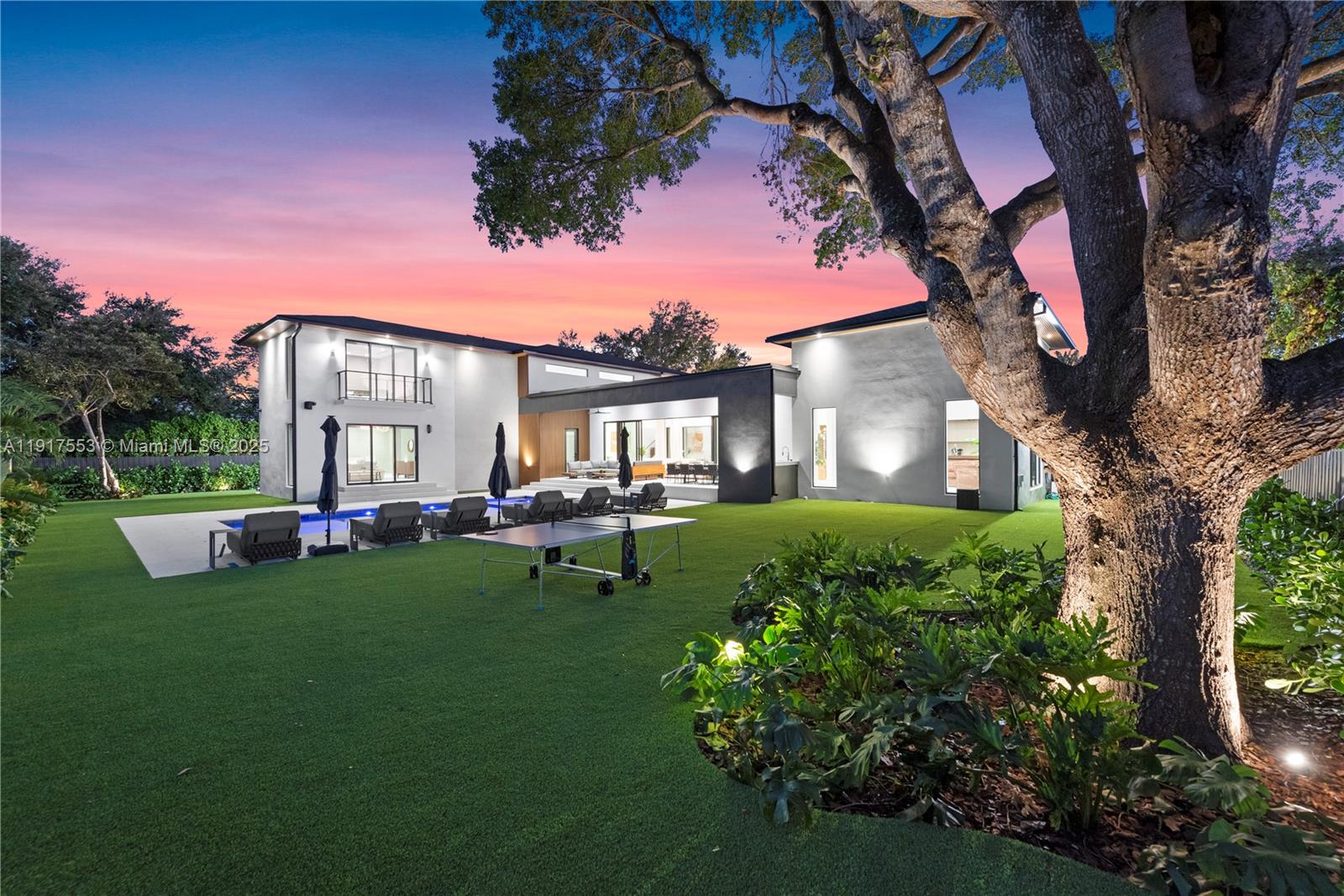 1881 Northeast 196th Terrace Miami, FL 33179 - Photo 47 of 98 a view of a house with backyard and a sitting area