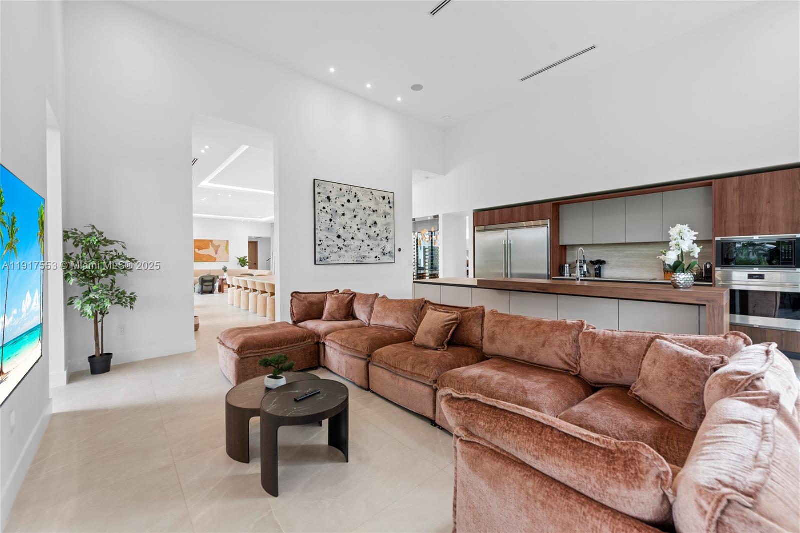 1881 Northeast 196th Terrace Miami, FL 33179 - Photo 56 of 98 a living room with furniture and a potted plant