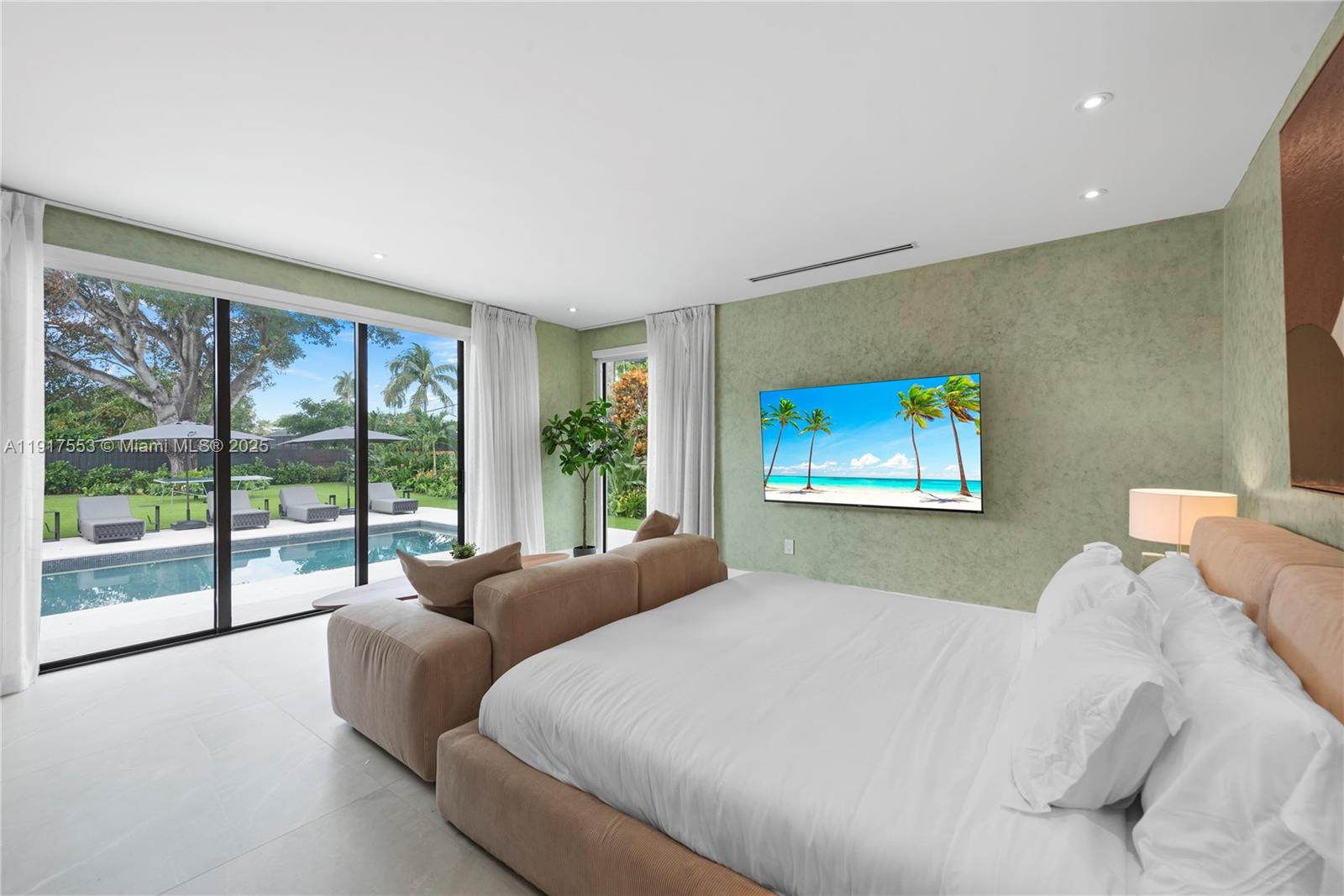 1881 Northeast 196th Terrace Miami, FL 33179 - Photo 59 of 98 a bedroom with a bed and a large window