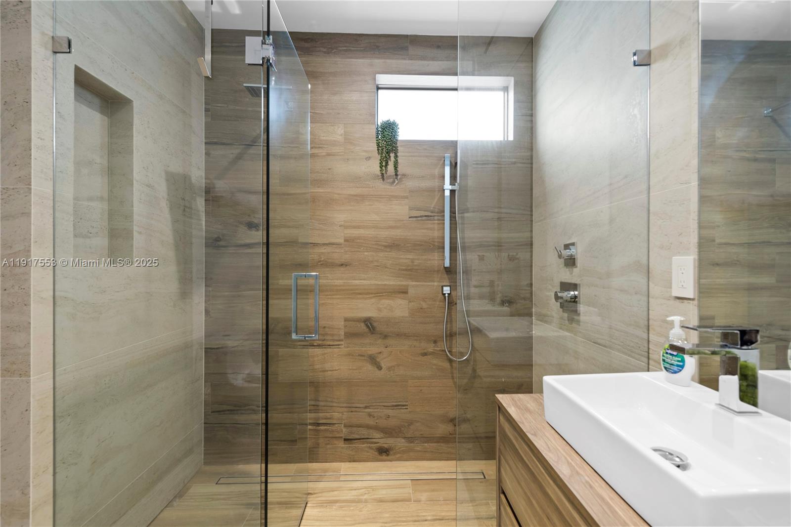 1881 Northeast 196th Terrace Miami, FL 33179 - Photo 65 of 98 a bathroom with a shower and a sink