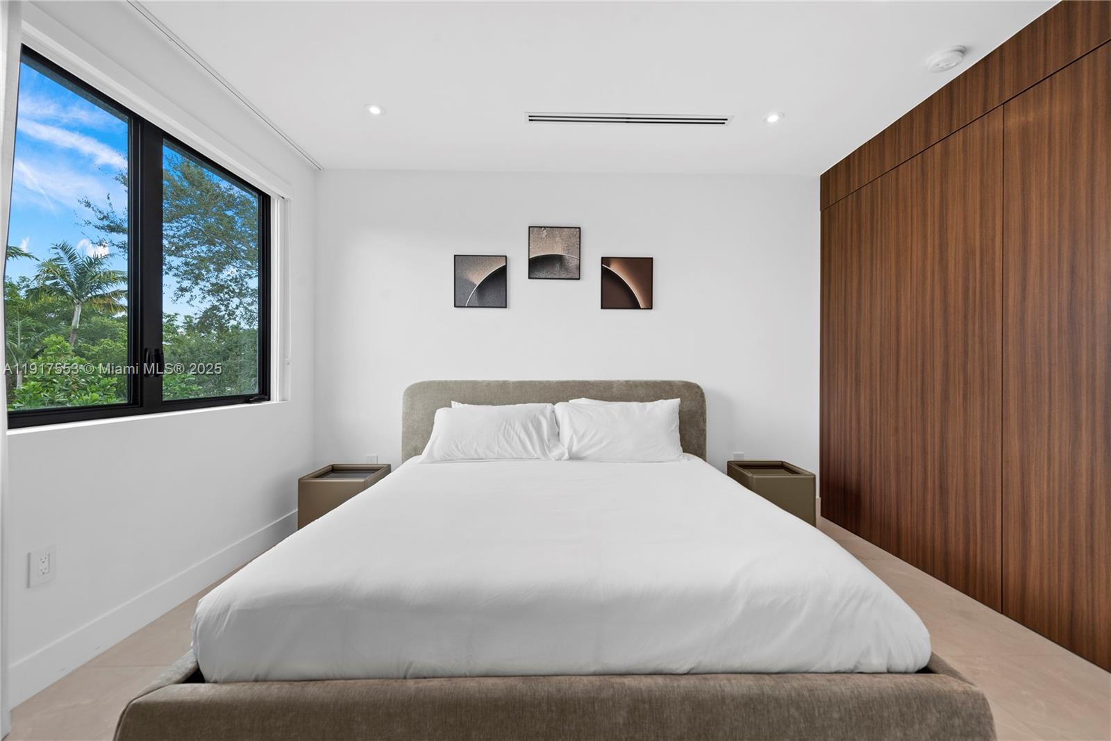 1881 Northeast 196th Terrace Miami, FL 33179 - Photo 69 of 98 a large white bed in a white room