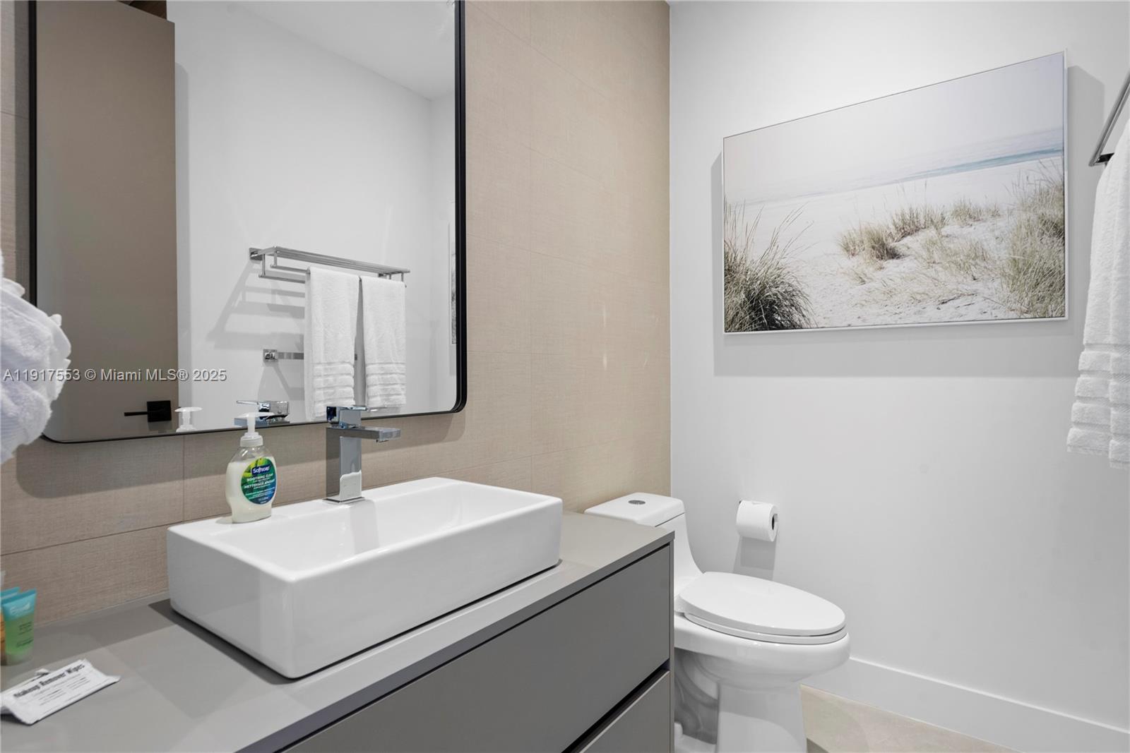 1881 Northeast 196th Terrace Miami, FL 33179 - Photo 73 of 98 a bathroom with a sink vanity mirror and toilet